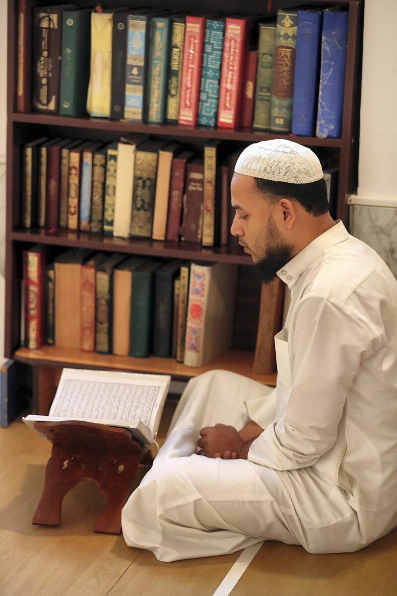 Dubai, United Arab Emirates - May 16, 2019: People read the holy quran. Mosque series for Ramdan. Lootah Masjid Mosque is an old mosque in Deira. Thursday the 16th of May 2019. Deira, Dubai. Chris Whiteoak / The National