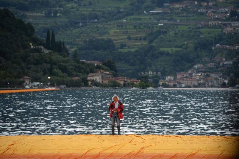 Christo walks on The Floating Piers on Lake Iseo, northern Italy on June 16, 2016. Filippo Monteforte / AFP Photo