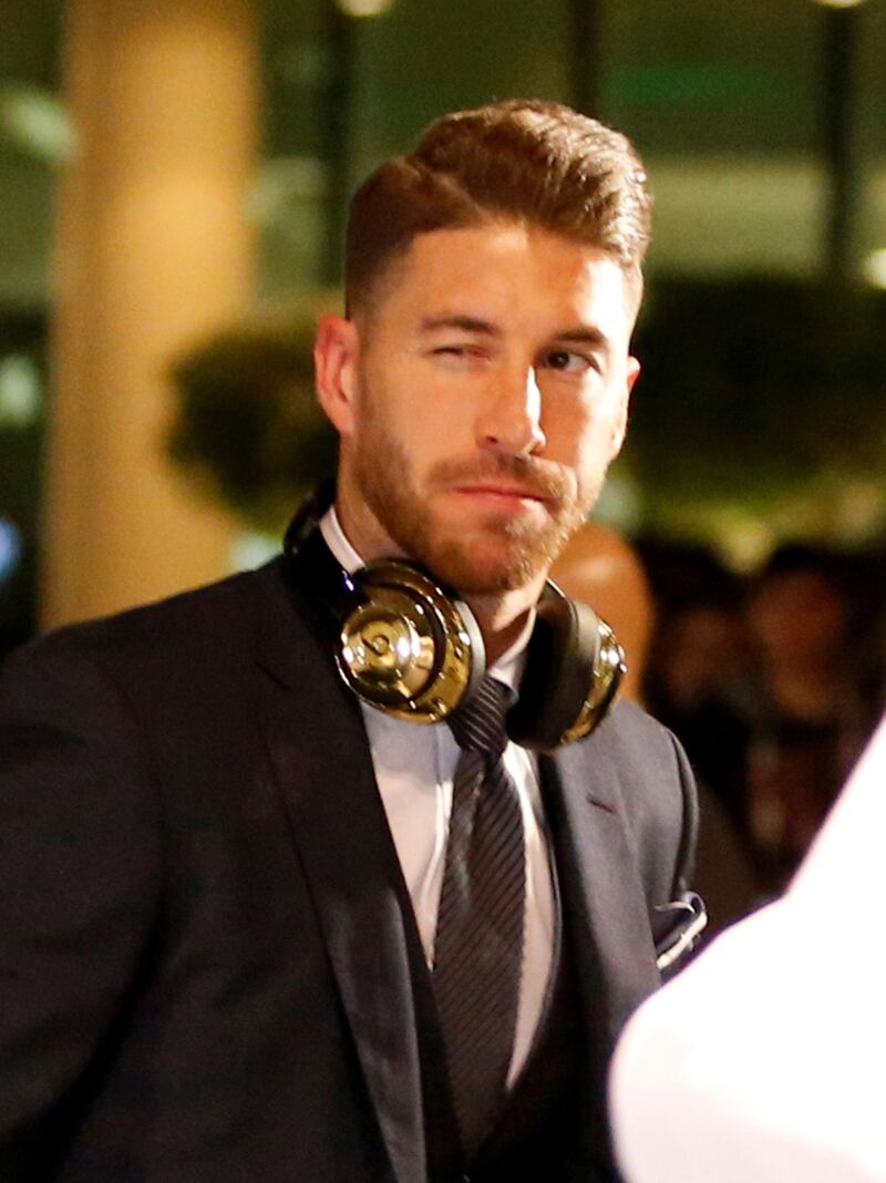 Real Madrid captain Sergio Ramos winks as he arrives. EPA