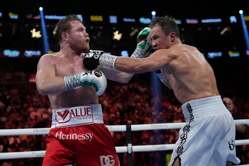 Canelo Alvarez and Gennady Golovkin exchange punches during their super middleweight title fight. AP