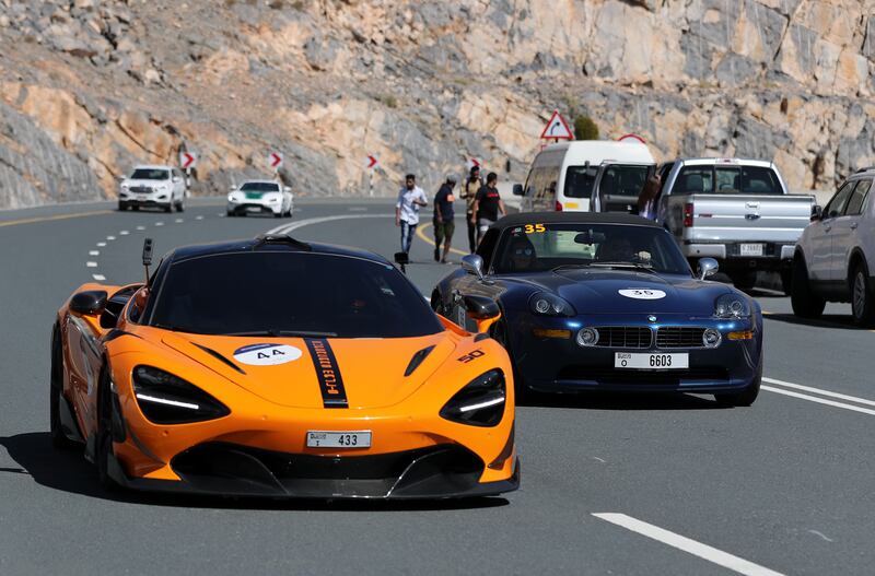 A McLaren, left, during  a climb.