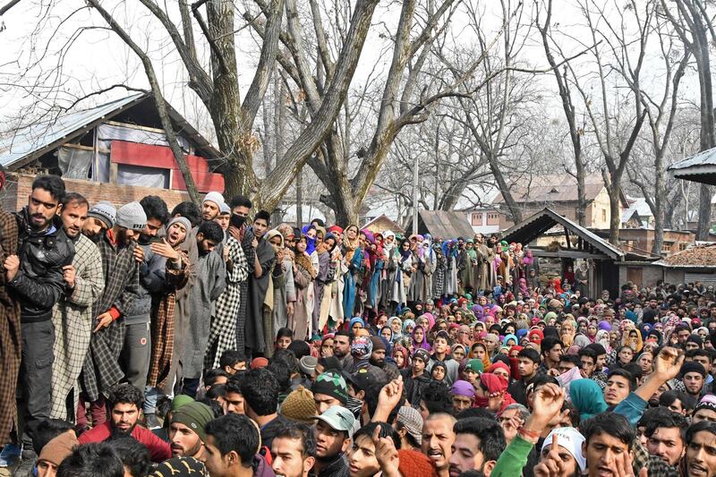 Kashmiri villagers look on during the funeral of militant commander Noor Mohammad Tantray in the Aripal village of Tral district on December 26, 2017.
Government forces have killed the  commander of a Pakistan-based militant group in Indian-administered Kashmir, police said December 26, as the disputed territory ended its deadliest year for a decade. Noor Mohammad Tantray, the head in the Kashmir valley of the Jaish-e-Mohammad group, was trapped in a house outside the main city of Srinagar on Monday evening along with his associates, triggering a fierce overnight gunbattle. / AFP PHOTO / Tauseef MUSTAFA