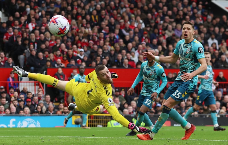 United's David de Gea looks on as the ball hits the post. Reuters