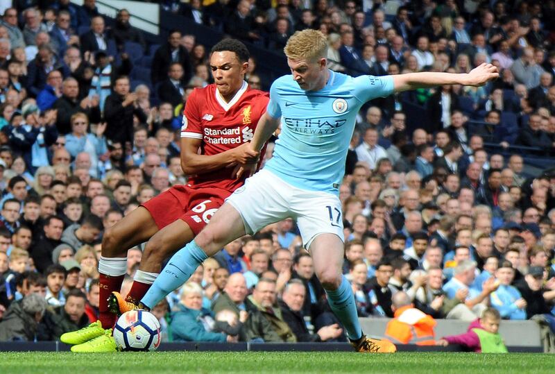 Liverpool's Trent Alexander-Arnold, left, and Manchester City's Kevin De Bruyne, right, challenge for the ball during the English Premier League soccer match between Manchester City and Liverpool at the Etihad Stadium in Manchester, England, Saturday, Sept. 9, 2017. (AP Photo/Rui Vieira)