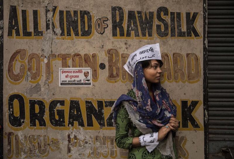 A Muslim supporter of the anti-corruption Aam Admi Party waits for a rally by its leader, Arvind Kejriwal, to pass through the Hindu holy town of Varanasi on May 9, 2014, the penultimate day of campaigning in India’s general election. Kevin Frayer / Getty Images