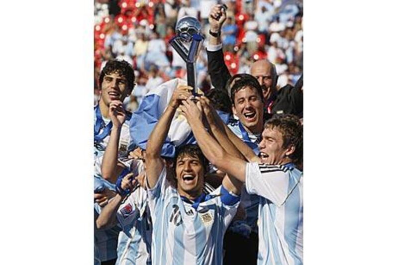 Argentina's Sergio Aguero, centre, holds up the Fifa Under 20 World Cup in Canada in 2007 after his side defeated the Czech Republic.