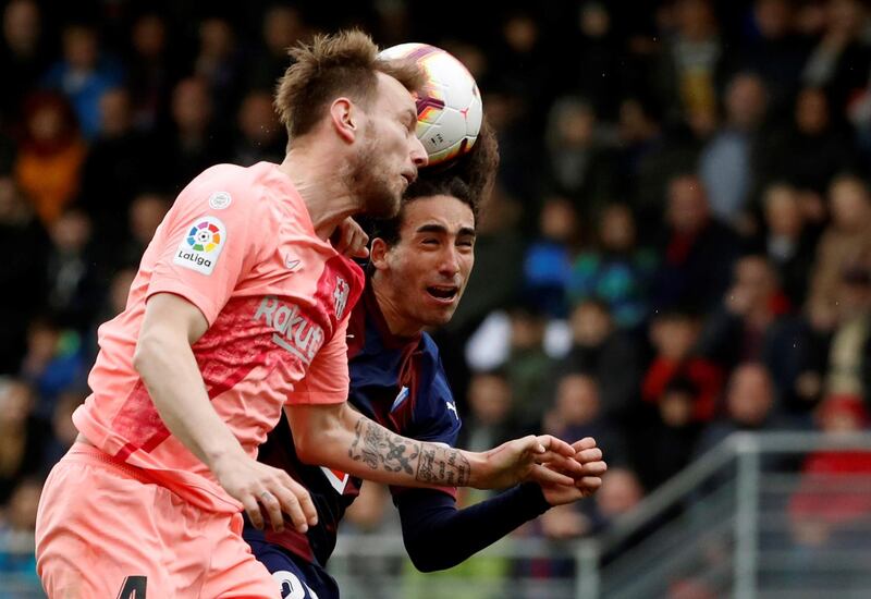 Eibar's Marc Cucurella, right, in action against FC Barcelona's Ivan Rakitic. EPA