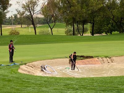 Part of the bunker beside the first fairway on the Majlis Course had collapsed due to heavy overnight rain. Paul Radley / The National