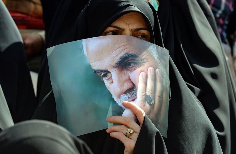 An Iranian carries a portrait of Qassem Suleimani, the former leader of the IRGC's Quds Force, at a gathering in Tehran last month. AFP