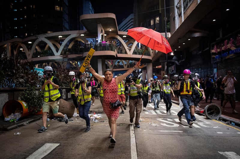 A photo by Nicolas Asfouri that shows a woman holding up an umbrella  during demonstrations in the Causeway Bay district of Hong Kong, on October 1, 2019, wins first prize in the General News Stories category. Nicolas Asfouri / AFP