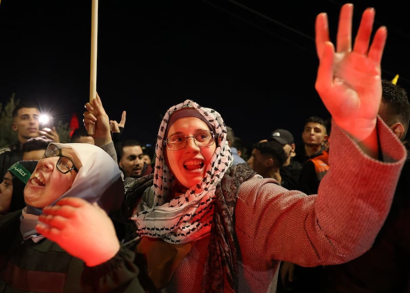 Palestinians in Beitonia, near Ramallah, celebrate the release of the group from Israeli detention. EPA