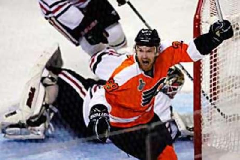 Philadelphia Flyers' Claude Giroux celebrates his game winning goal during overtime in Game 3.