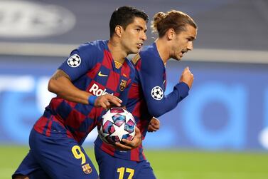 epa08604350 Luis Suarez (L) of Barcelona celebrates with Antoine Griezmann of Barcelona after scoring the second goal for his team during the UEFA Champions League quarter final match between Barcelona and Bayern Munich in Lisbon, Portugal, 14 August 2020. EPA/Rafael Marchante / POOL