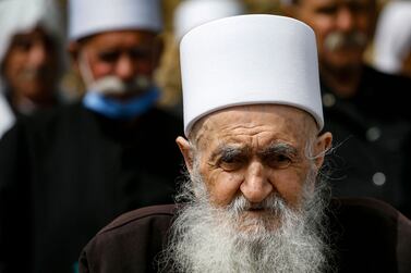 Druze residents of the Israeli-annexed Golan Heights gather during a rally in the village of Majdal Shams to mark Syria's Independence Day, on April 17, 2022.  (Photo by Jalaa MAREY  /  AFP)