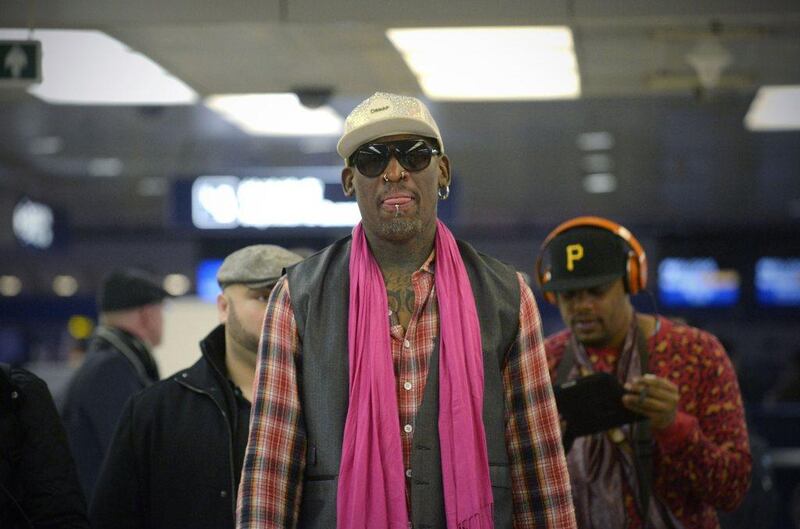 Former NBA basketball player Dennis Rodman of the US waits to check in for his flight to North Korea after his arrival at Beijing's international airport.  Rodman, who visited Pyongyang in December, will visit North Korea from January 6 to 10. Wamng Zhao / AFP Photo