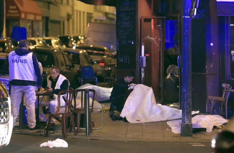 Victims lay on the pavement outside a Paris restaurant. Thibault Camus/AP Photo