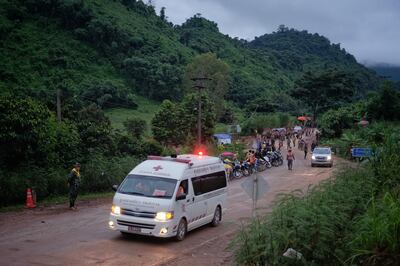 CHIANG RAI, THAILAND - JULY 8: An ambulance carrying one of the boys rescued from Tham Luang Nang Non cave heading towards the hospital on July 8, 2018 in Chiang Rai, Thailand. Divers began an effort to pull the 12 boys and their soccer coach on Sunday morning after they were found alive in the cave at northern Thailand. Videos released by the Thai Navy SEAL shows the boys, aged 11 to 16, and their 25-year-old coach are in good health in Tham Luang Nang Non cave and the challenge now will be to extract the party safely. (Photo by Linh Pham/Getty Images)
