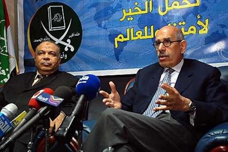 Mohamed ElBaradei, right, used Twitter to renew his call for the Muslim Brotherhood to boycott Egypt's upcoming election. He is pictured with Saad Alkatani, a member of the Muslim Brotherhood and of the Egyptian parliament.