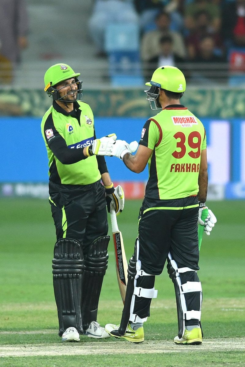 Lahore Qalanadars batsmen Sohail Akhtar, left, and Fakhar Zaman confer.