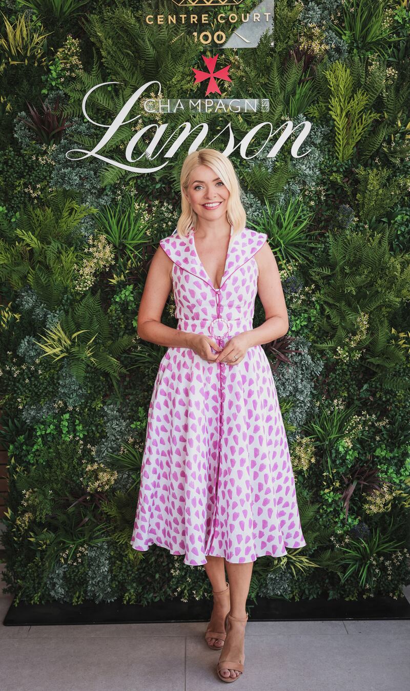 British TV presenter Holly Willoughby arrives for opening day at The Championships, Wimbledon on June 27, in London, England. Getty Images for Champagne Lanson