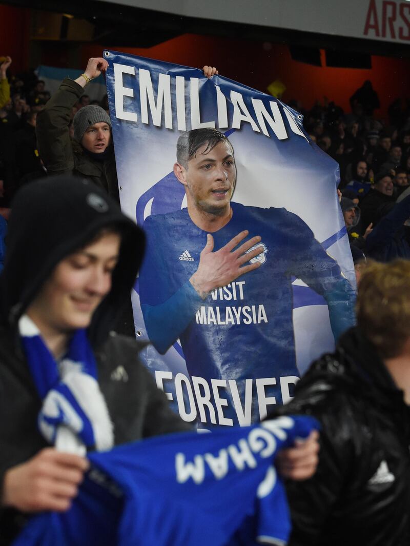 epa07330574 Cardiff City supporters display tributes for Argentinian soccer player Emiliano Sala, who went missing on 21 January 2019 after a light aicraft he was travelling in from Nantes in France to Cardiff disapeared over the English Channel, during the English Premier League soccer match between Arsenal and Cardiff City at the Emirates stadium in London, Britain, 29 January 2019.  EPA/FACUNDO ARRIZABALAGA EDITORIAL USE ONLY. No use with unauthorized audio, video, data, fixture lists, club/league logos or 'live' services. Online in-match use limited to 120 images, no video emulation. No use in betting, games or single club/league/player publications