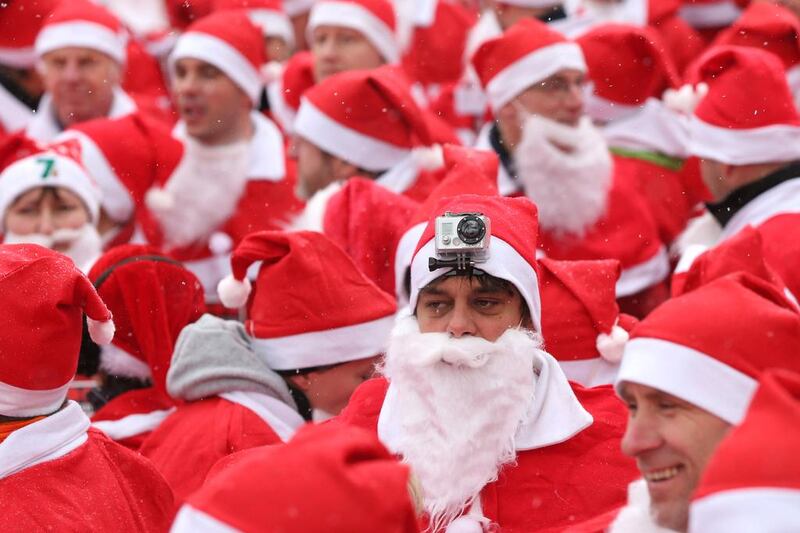 A participant dressed as Santa Claus with a GoPro camera on his head joins the 4th annual Michendorf Santa Run on December 9, 2012. Sean Gallup / Getty Images
