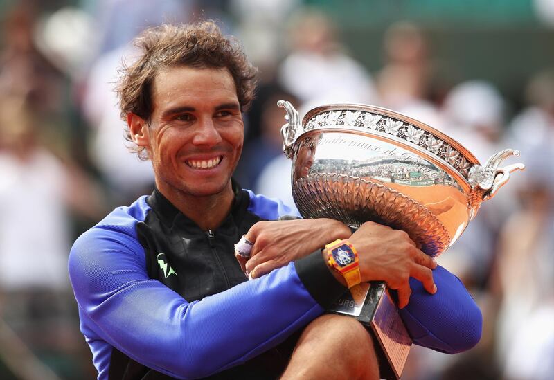 PARIS, FRANCE - JUNE 11:  Rafael Nadal of Spain celebrates victory with the trophy after the men's singles final against Stan Wawrinka of Switzerland on day fifteen of the French Open at Roland Garros on June 11, 2017 in Paris, France.  (Photo by Julian Finney/Getty Images)