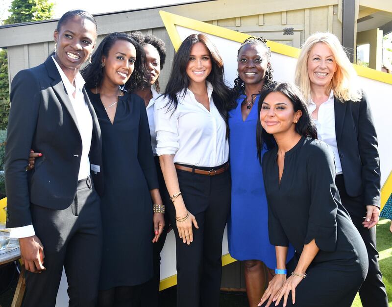 LONDON, ENGLAND - SEPTEMBER 12: Meghan, Duchess of Sussex poses for a photograph with women dressed in clothes from the Smart Works capsule collection during the collection's launch on September 12, 2019 in London, England. Created in September 2013 Smart Works exists to help unemployed women regain the confidence they need to succeed at job interviews and return to employment. (Photo by Mark Large - WPA Pool/Getty Images)