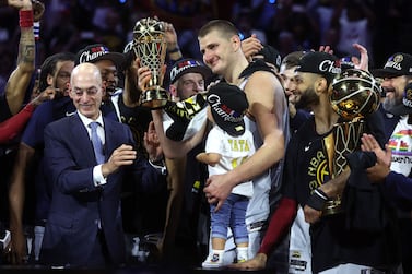 DENVER, COLORADO - JUNE 12: Nikola Jokic #15 of the Denver Nuggets is presented the Bill Russell NBA Finals Most Valuable Player Award after a 94-89 victory against the Miami Heat in Game Five of the 2023 NBA Finals to win the NBA Championship at Ball Arena on June 12, 2023 in Denver, Colorado.  NOTE TO USER: User expressly acknowledges and agrees that, by downloading and or using this photograph, User is consenting to the terms and conditions of the Getty Images License Agreement.    Matthew Stockman / Getty Images / AFP (Photo by MATTHEW STOCKMAN  /  GETTY IMAGES NORTH AMERICA  /  Getty Images via AFP)