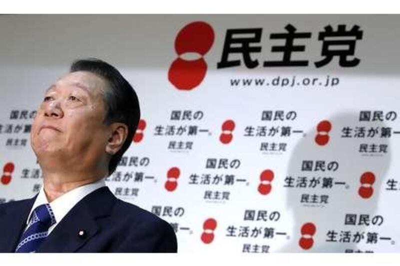Ichiro Ozawa, the former leader of the ruling Democratic Party of Japan, says he will stick to his plan to challenge Naoto Kan, the prime minister, in a party leadership election, setting up a showdown that threatens to create a policy vacuum as Japan struggles with a strong yen.