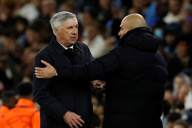 FILE PHOTO: Soccer Football - Champions League - Semi Final - First Leg - Manchester City v Real Madrid - Etihad Stadium, Manchester, Britain - April 26, 2022  Real Madrid coach Carlo Ancelotti and Manchester City manager Pep Guardiola after the match Action Images via Reuters / Jason Cairnduff / File Photo
