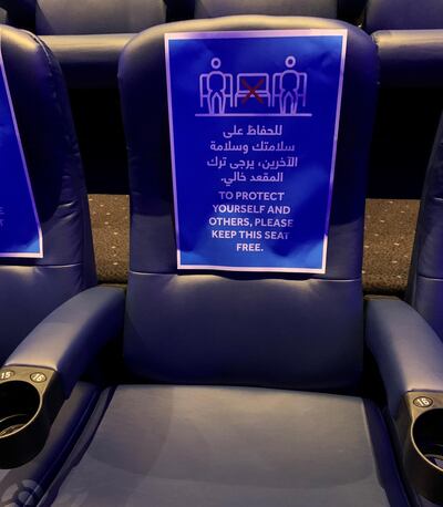 Empty seats in Vox Cinemas’ auditoriums in Dubai have been plastered with cautionary notices