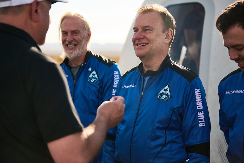 In this photo provided by Blue Origin, NS-21 (New Shepard-21), astronaut Hamish Harding receives his Blue Origin astronaut pin after a successful flight to space on June 4, 2022, in Van Horn, Texas.  According to Action Aviation, a company for which Harding serves as chairman, the U. K.  businessman was one of the mission specialists onboard a missing submersible carrying five people to view the wreckage of the Titanic that was reported overdue late Sunday, June 18, 2023.  (Felix Kunze / Blue Origin via AP)