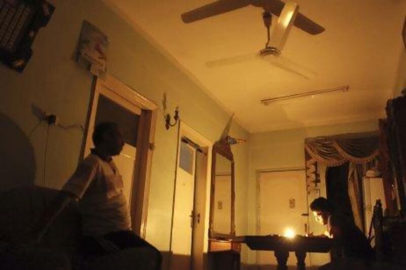 Mostafa Khaled studies by candlelight for his early morning exams during a power cut in Toukh, about 25 kilometres northeast of Cairo.