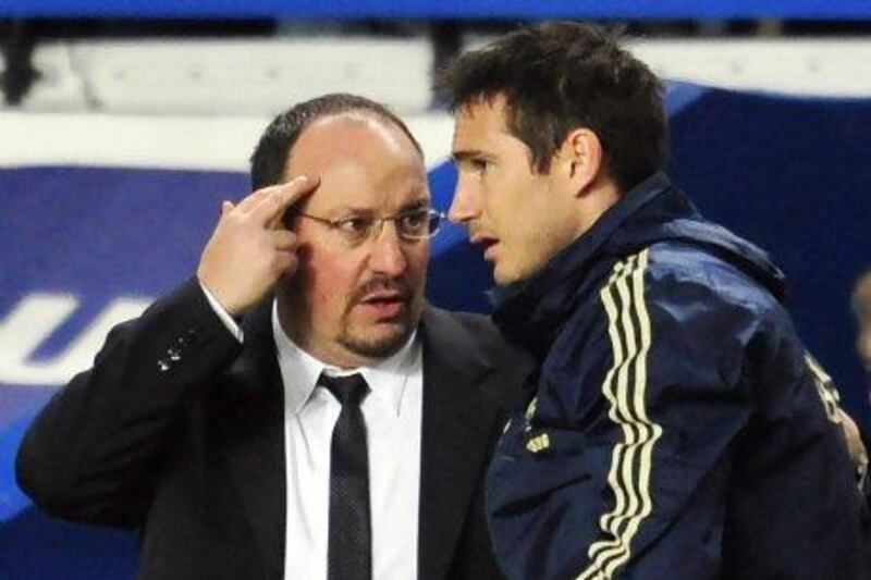 Chelsea's Spanish interim manager Rafael Benitez (L) talks to Chelsea's English midfielder Frank Lampard before he is substituted during the English League Cup first leg semi-final football match between Chelsea and Swansea City at Stamford Bridge in London on January 9, 2013. AFP PHOTO / GLYN KIRK

RESTRICTED TO EDITORIAL USE. No use with unauthorized audio, video, data, fixture lists, club/league logos or ìliveî services. Online in-match use limited to 45 images, no video emulation. No use in betting, games or single club/league/player publications.