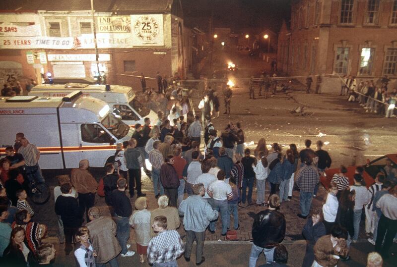 People gather at the scene of a car bomb explosion outside the Sinn Fein headquarters in West Belfast in Northern Ireland in September 1994. AP