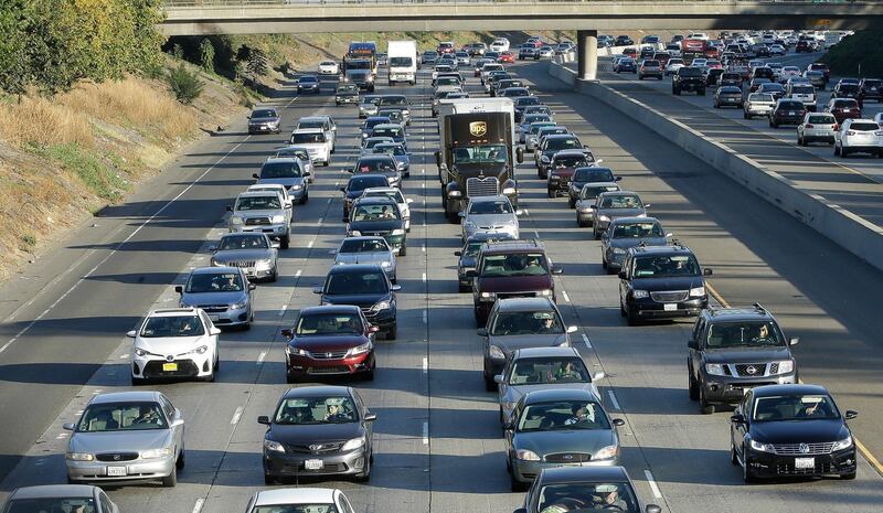 FILE - In this Monday, Oct. 30, 2017, file photo, vehicles crowd Highway 50 in Sacramento, Calif. California Attorney General Xavier Becerra announced, Friday Sept. 20, 2019 that 23 states have filed a lawsuit to stop the Trump administration from revoking California's authority to set emission standards for cars and trucks. (AP Photo/Rich Pedroncelli, File)