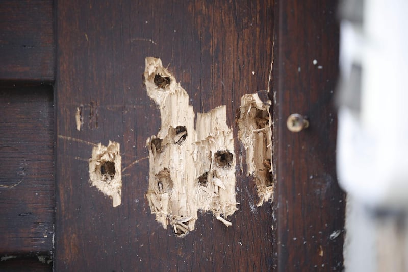 Bullet holes in a door of the synagogue in Halle, eastern Germany, where two people were killed and two injured in a gun attack on October 9, 2019 as Jews celebrated the festival of Yom Kippur. AFP