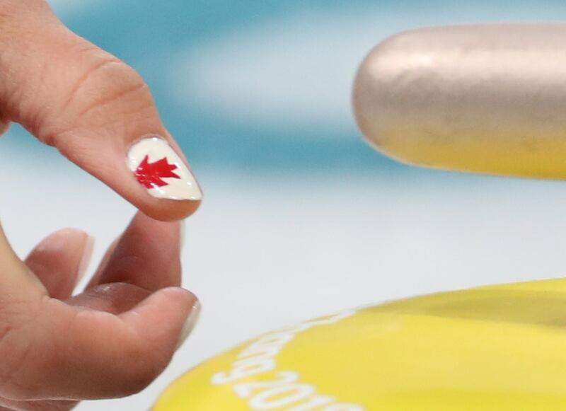 Rachel Homan dons a maple leaf on her nails seen during Women's Curling Round Robin match between Canada and Denmark. Javier Etxezarrata / EPA