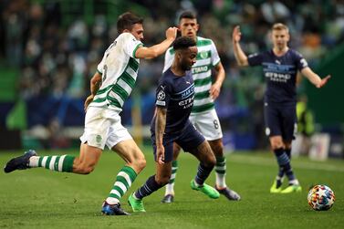 Manchester City's Raheem Sterling (centre) and Sporting Lisbon's Maria Joao Palhinha (left) battle for the ball during the UEFA Champions League Round of 16 1st Leg match at the Jose Alvalade Stadium, Lisbon. Picture date: Tuesday February 15, 2022.