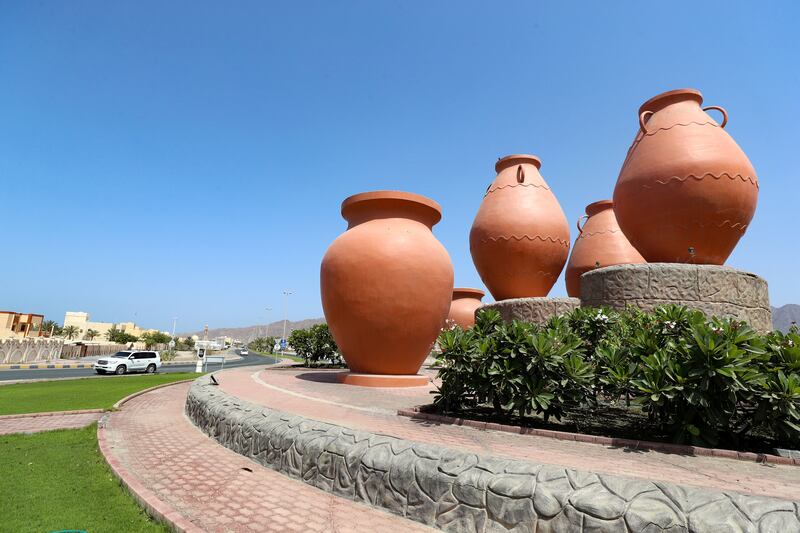 A collection of Arab pots decorate another roundabout in Dibba.