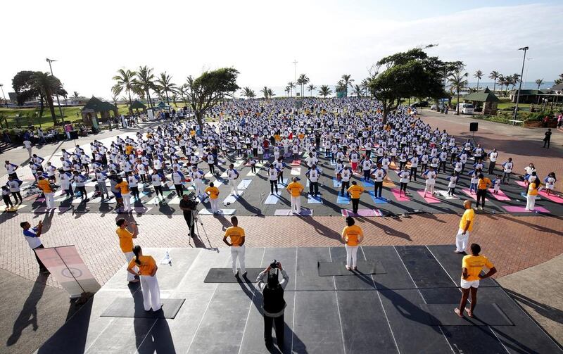 People participate in a group yoga session ahead of International Yoga Day in Durban, South Africa. Rogan Ward / Reuters