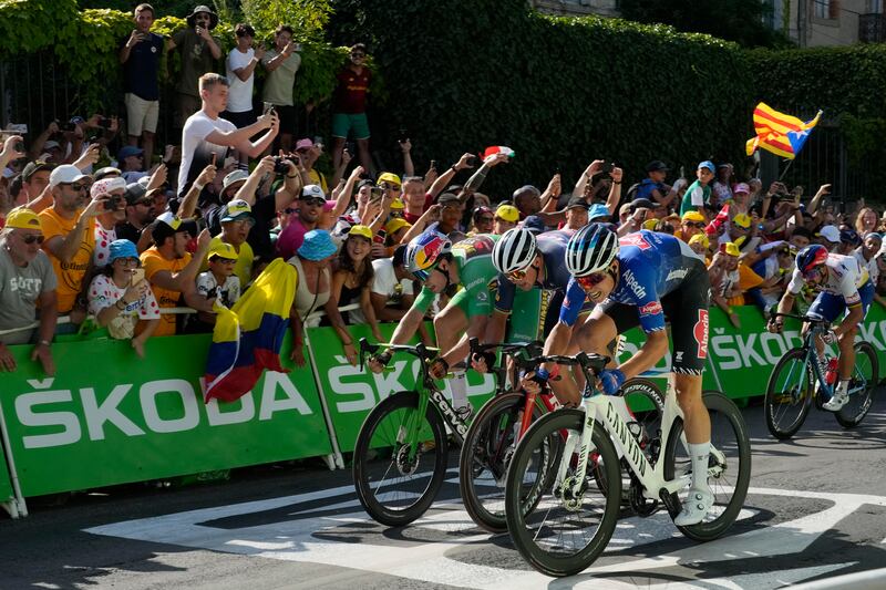 Jasper Philipsen edges out Wout Van Aert and Mads Pedersen to win Stage 15 of the 2022 Tour de France on Sunday, July 17. AP