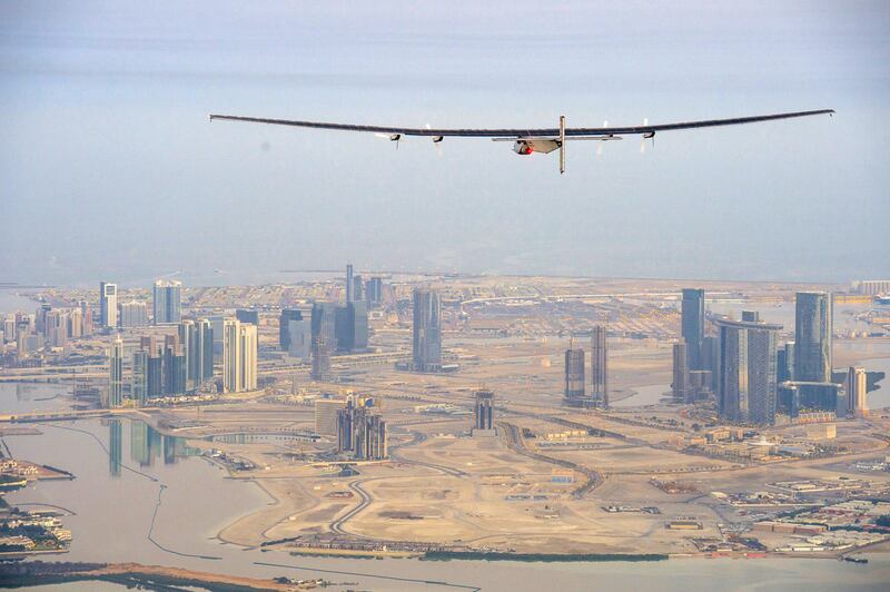 'Solar Impulse 2' flies over Abu Dhabi's Reem Island during a test flight.