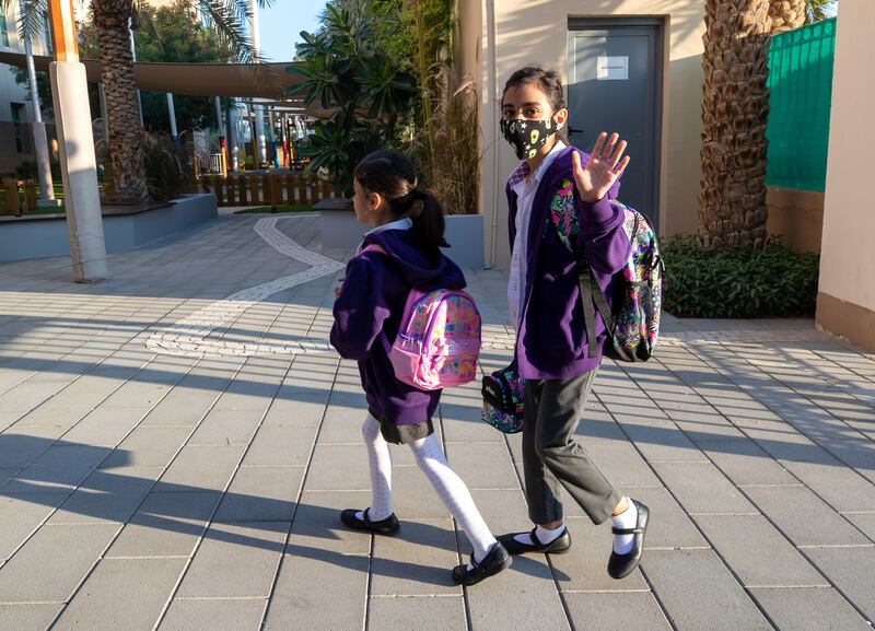 Pupils arrive for in-person classes at American Academy for Girls in Dubai. Some classes have four-fifths of pupils attending.