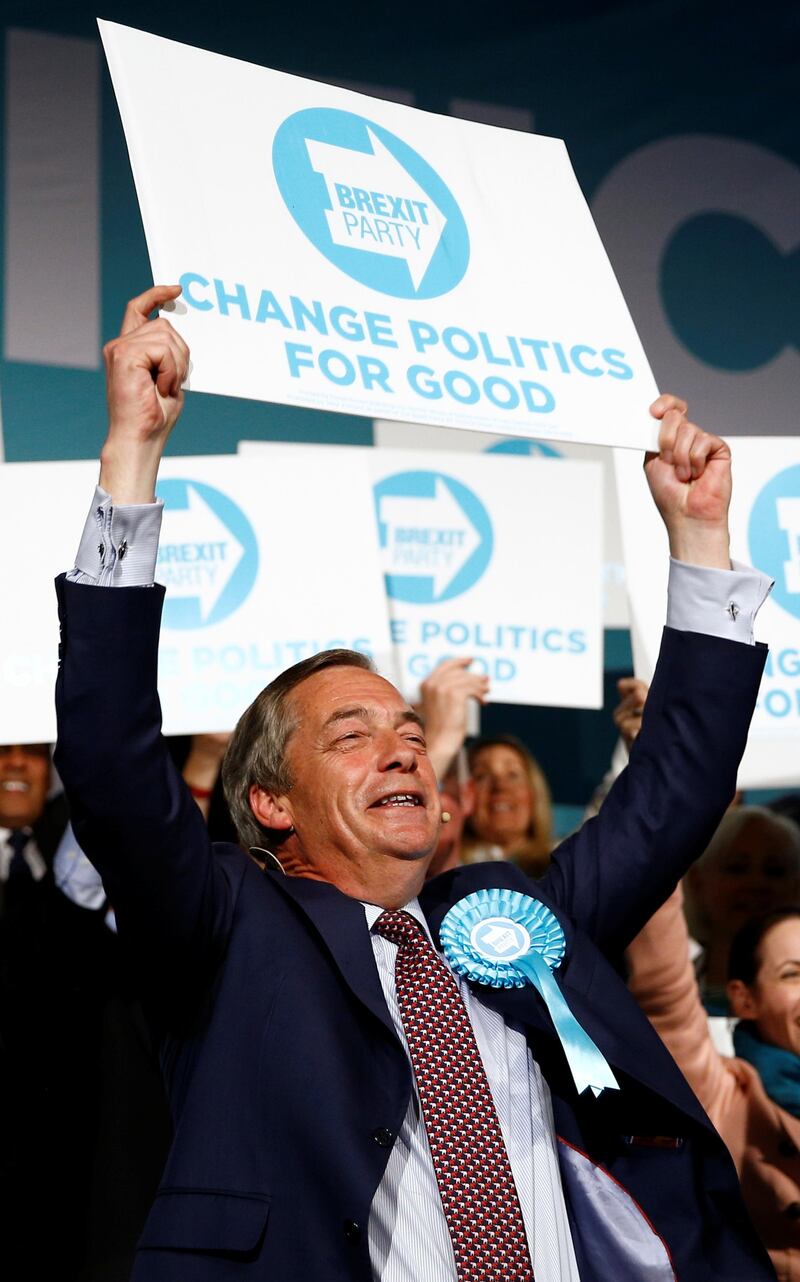 Brexit Party leader Nigel Farage holds up a placard at a Brexit Party campaign event in London, Britain, May 21, 2019. REUTERS/Henry Nicholls