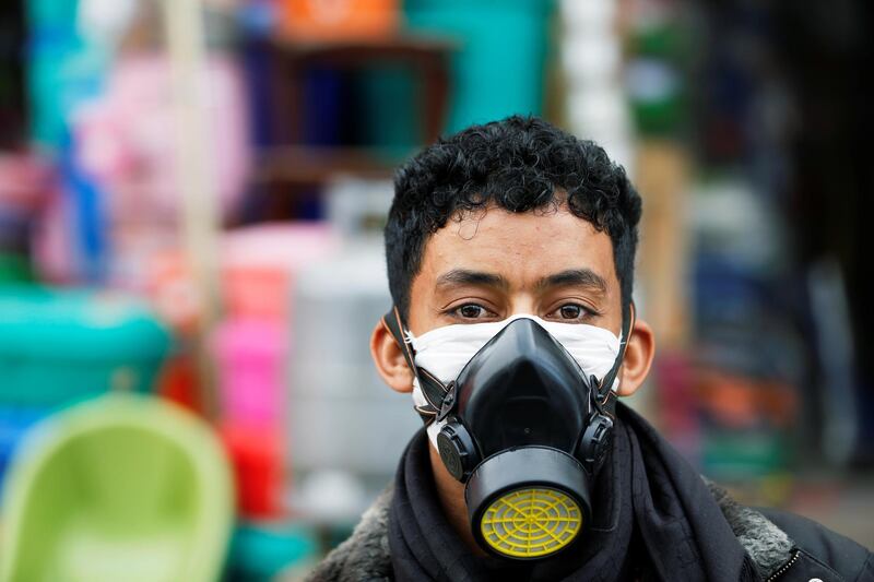 A man wears a protective face mask outside a shop amid concerns over the spread of the coronavirus, in Sanaa, Yemen on May 13, 2020. Reuters