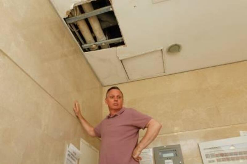 Dubai, 13th March 2012.  John Robins is upset in spite of his payment for Nakheel's service charges on building maintenance and AC usage, at Building 88 Discovery Gardens.  ( Jeffrey E Biteng / The National )