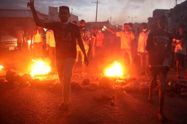 Sudanese people burn tires as they march in protest for the deaths of other students earlier the day. EPA