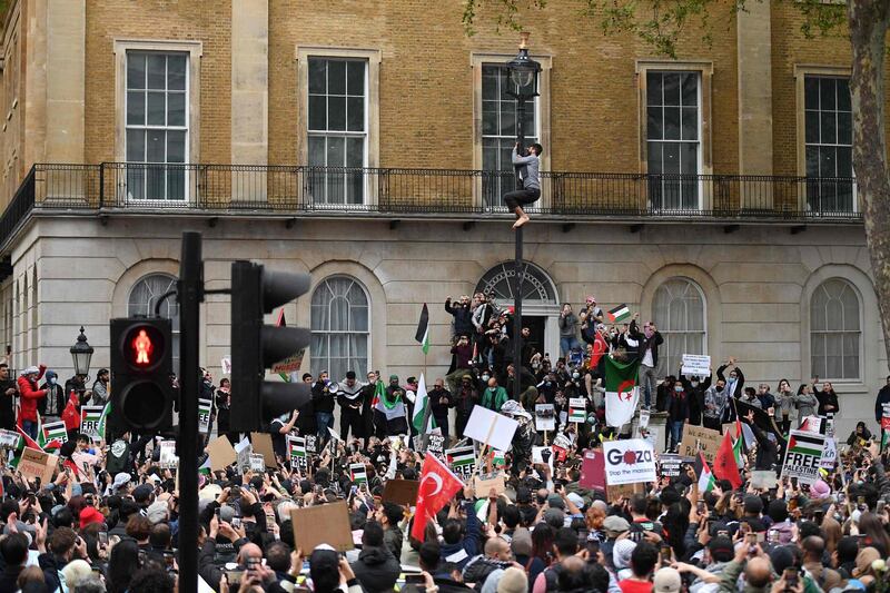 Pro-Palestinian activists participate in a demonstration outside Downing Street. AFP